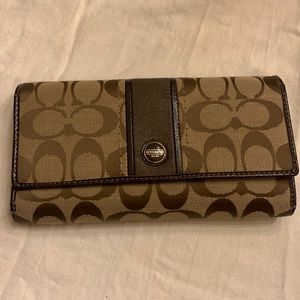 Coach monogram wallet with brown patent leather trim